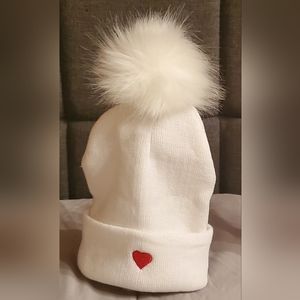 1 White Adult hat w/ 1 White detachable pom. Called PURE OF HEART. I make others
